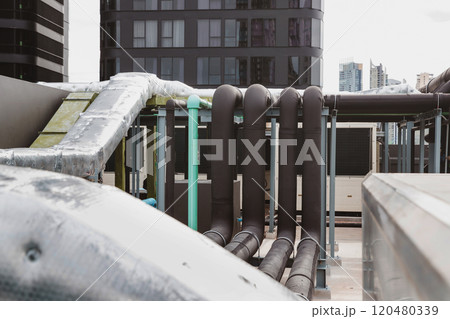 Pipe of air conditioner system on roof. a lot of pipe for air conditioner system. Industrial air conditioning tubes. Ventilation system and pipe systems installed on industrial building. 120480339