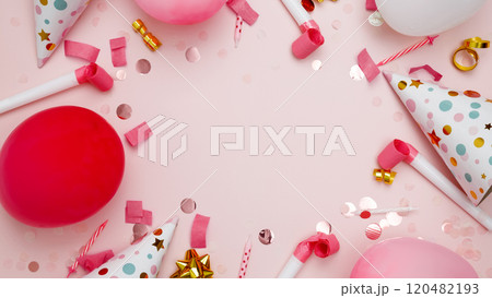 Concept of festive birthday celebrations. Birthday attributes colorful balloons, party hats, candles, confetti Concept of festive birthday celebrations. Birthday attributes colorful balloons, party hats, candles, confetti 120482193