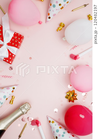 Birthday attributes colorful balloons, party hats, candles, and confetti. Concept of festive birthday celebrations Birthday attributes colorful balloons, party hats, candles, and confetti. Concept of festive birthday celebrations 120482197