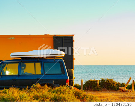 Camper van with closed tent on roof top Camper van with closed tent on roof top 120483150
