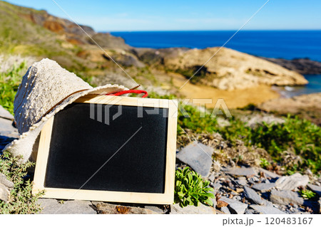Blank black board against sea coast 120483167