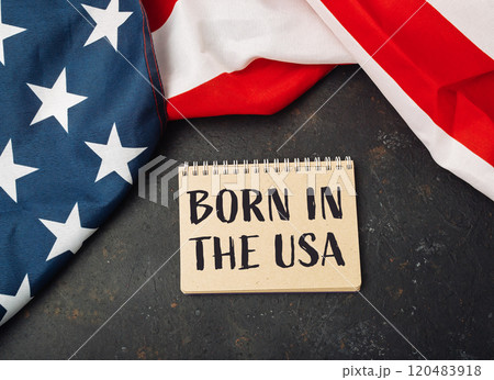Piece of paper with the words Born in the USA written on it 120483918