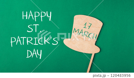 Green background with a hat on it 120483956