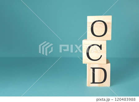 Three wooden blocks stacked on top of each other 120483988