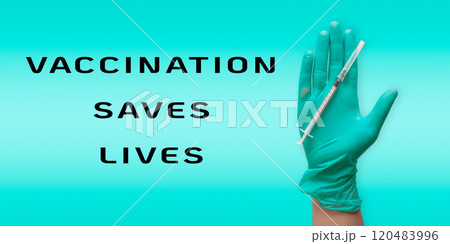 Hand holding a syringe with the words Vaccination saves lives Hand holding a syringe with the words Vaccination saves lives 120483996