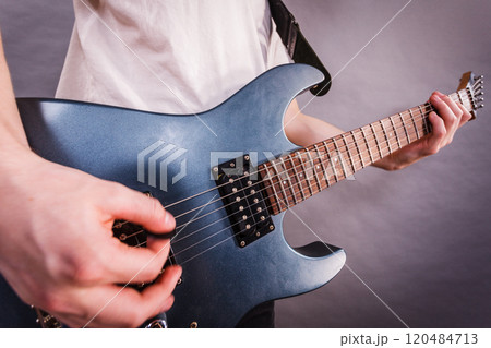 Close up of man playing on electric guitar Close up of man playing on electric guitar 120484713