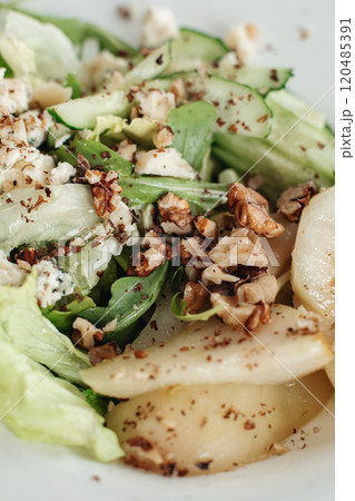 Salad with blue cheese, pears, nuts, chard and 120485391