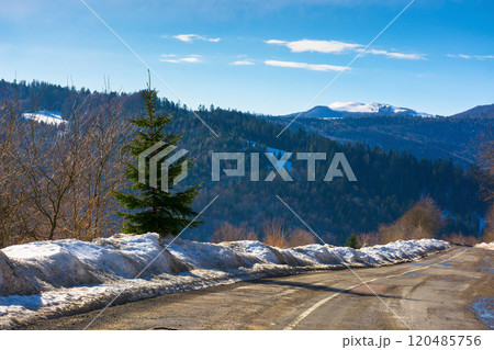 road in carpathian mountains. travel destination. sunny day in winter. beautiful view road in carpathian mountains. travel destination. sunny day in winter. beautiful view 120485756