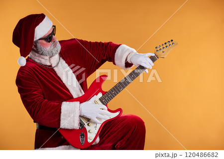 Santa Claus Rocking out on Red Electric Guitar 120486682