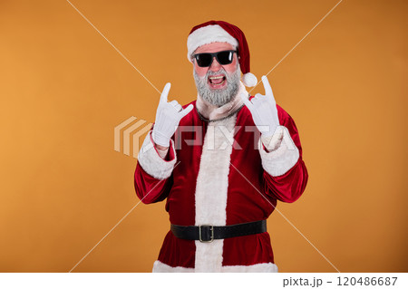 Wearing Santa Claus Outfit and Rocking Hand Signs 120486687