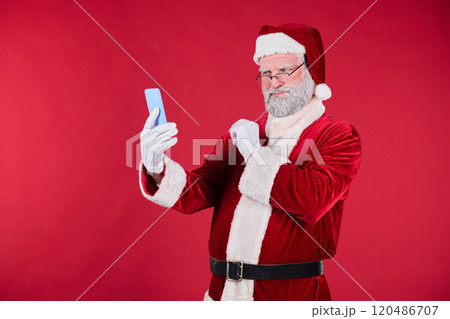 Smiling Santa Claus Taking Selfie on Red Background Smiling Santa Claus Taking Selfie on Red Background 120486707