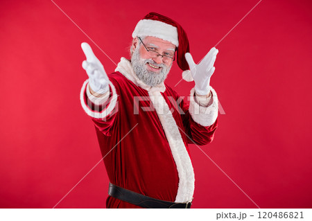 Smiling Santa Claus Pointing at Camera in Festive Setting 120486821