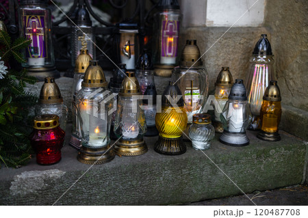 Decorated graves at a cemetery on All Saints Day (Wszystkich Swietych) in Poland. 120487708
