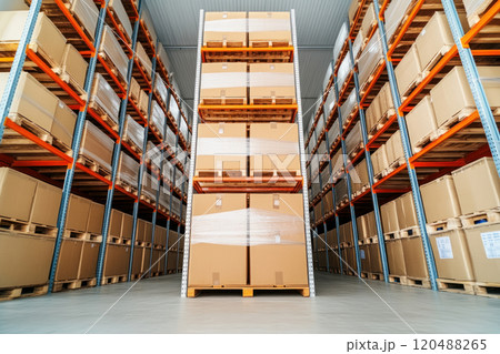 Modern warehouse interior with stacked cardboard boxes on pallets. 120488265