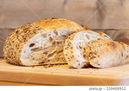 Homemade bread, sourdough wheat loaf with seeds 120488912