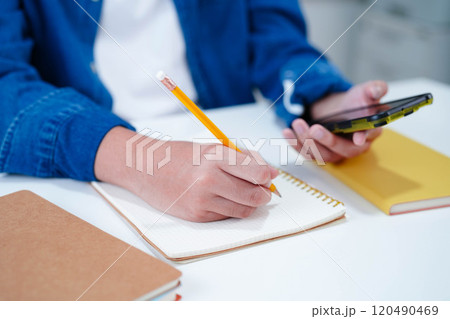 Teenage using smart phone for communication, search data internet website to learn. 120490469