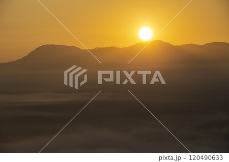 The sun rising in a valley with a sea of fog 120490633