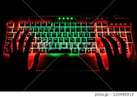 Hands Over Brightly Illuminated Keyboard 120490919