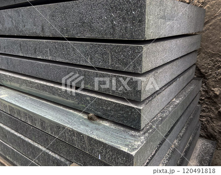 Granite slabs stand in rows. Granite slabs for tombstones. Workshop for funeral tombstones. Funeral business. Tombstones. Granite slabs stand in rows. Granite slabs for tombstones. Workshop for funeral tombstones. Funeral business. Tombstones. 120491818