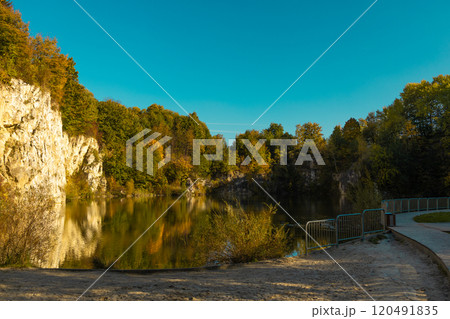 Autumn forest lake in Poland. Autumn lake in autumn forest. The autumn foliage of the trees is reflected in the lake water 120491835