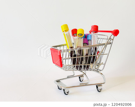 Some glasses vacutainer with blood analysis in a shopping basket.  120492006