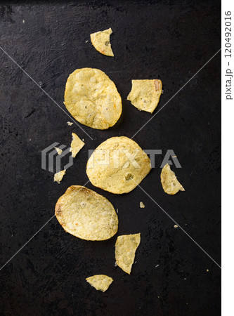 Crispy salty homemade potato chips 120492016