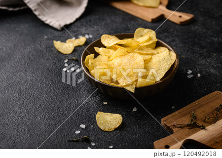 Crispy salty homemade potato chips 120492018