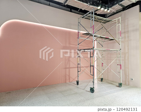 Scaffold tower ladder in renovated room. Scaffold tower ladder in renovated room. 120492131