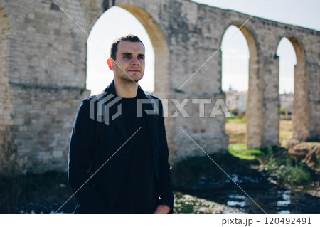 young man near the ancient Kamares Aqueduct, Larnaca, Cyprus 120492491