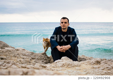 a young man on rocky coast with turquoise water of Ayia Napa, Cyprus 120492908