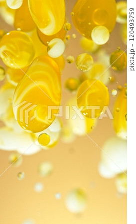 Macro Shot of Moving Oil and Milk Bubbles on Golden Background, Cosmetics Concept Macro Shot of Moving Oil and Milk Bubbles on Golden Background, Cosmetics Concept 120493759