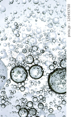 Macro Shot of Moving Oil Bubbles on Light Background Macro Shot of Moving Oil Bubbles on Light Background 120493780