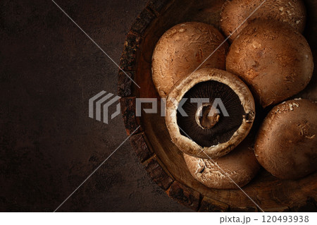 fresh Portobello mushrooms, in a wooden bowl, top view, close-up, no people, 120493938