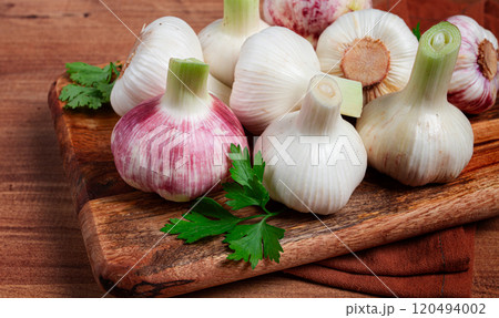 Fresh young garlic, white and purple color, on a wooden table, no people, 120494002