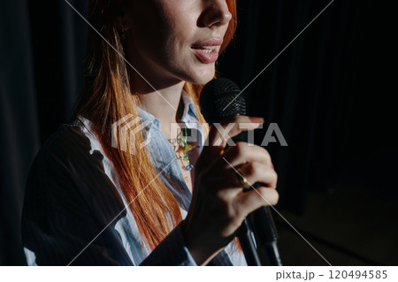 Singing into Microphone with Eyes Closed during Performance 120494585
