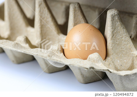 Chicken egg in egg box Made from recycle material in nature light. 120494872