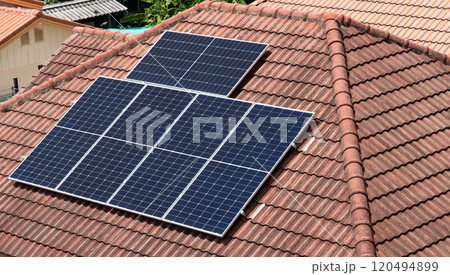 Solar Panel on The modern House Roof, House with installed solar panels on roof. Alternative energy source. Solar Panel on The modern House Roof, House with installed solar panels on roof. Alternative energy source. 120494899