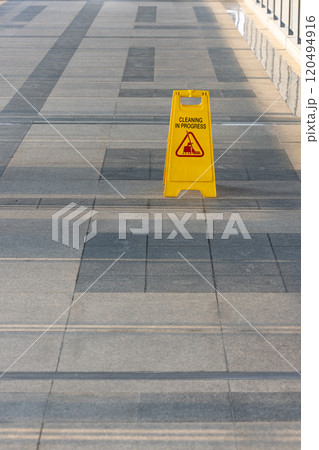 Sign showing warning of cleaning process area, Yellow sign that alerts for cleaning process, Warning symbol of Slippy floor for pedestrian. Sign showing warning of cleaning process area, Yellow sign that alerts for cleaning process, Warning symbol of Slippy floor for pedestrian. 120494916