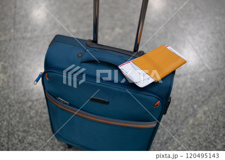 Travel accessories costumes for the tripimage, one suitcase in an empty airport hall, traveler case in the departure airport terminal waiting for the area, vacation concept, blank space for text Travel accessories costumes for the tripimage, one suitcase in an empty airport hall, traveler case in the departure airport terminal waiting for the area, vacation concept, blank space for text 120495143