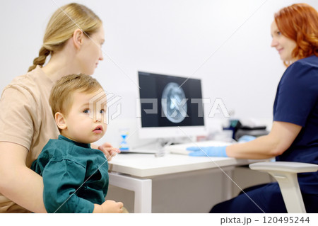 Toddler boy with his mom are at appointment with a pediatric neurologist. A mother tells an attentive doctor about her baby injury 120495244