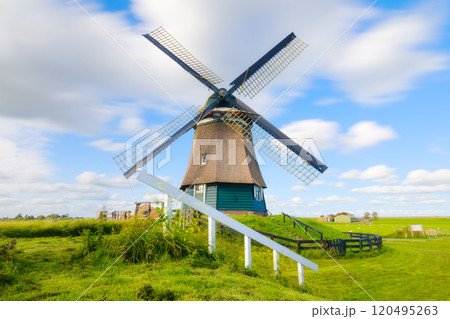 Landscape with windmill. Dutch. Agricultural fields and pastures. 120495263