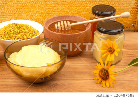 Fresh flower honey in a wooden bowl, spoon and honeycomb. vitamin food for health and life 120497598