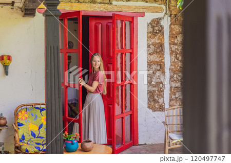 Female tourist in a colonial house in San Cristobal de las Casas, Mexico. Cultural exploration, architecture, and travel experience concept Female tourist in a colonial house in San Cristobal de las Casas, Mexico. Cultural exploration, architecture, and travel experience concept 120497747
