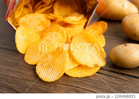 Potato chips , delicious BBQ seasoning spicy for crips, thin slice deep fried snack fast food. Potato chips , delicious BBQ seasoning spicy for crips, thin slice deep fried snack fast food. 120498055