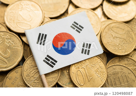 Korea flag on coin and banknote money, finance trading investment business currency concept. 120498087