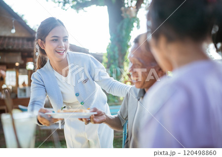 asian mother caring for family member 120498860