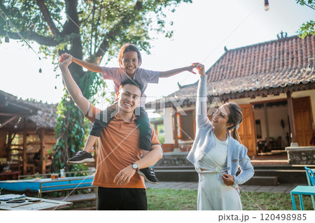 young asian parent having fun with daughter 120498985