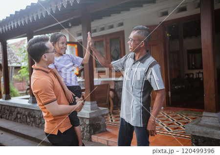 cute grandchild high five asian grandfather cute grandchild high five asian grandfather 120499396