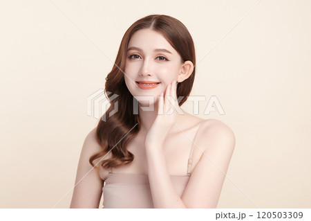 Beautiful young asian woman with clean fresh skin on beige background, Face care, Facial treatment, Cosmetology, beauty and spa, Asian women portrait. 120503309