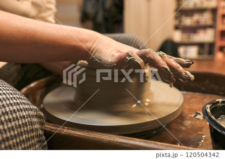 clay potter artist making pot shape on wheel pedestal clay potter artist making pot shape on wheel pedestal 120504342